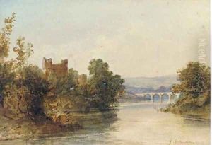 Castle ruins on the banks of a river, a bridge beyond