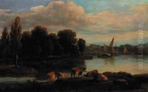 Cattle on the bank of a river with a town beyond Cattle on the bank of a river with a town beyond