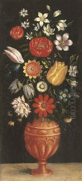 Tulips, roses, carnations and other flowers in a vase on a stone ledge - view 1
