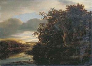 A wooded river landscape with travellers on a path by Isaak van Ruisdael