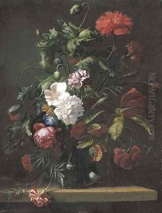 Roses, carnations, morning glory and other flowers in a glass vase on a stone ledge