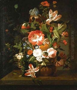 Tulips, roses, morning glory, an iris and other flowers in an urn on a stone ledge