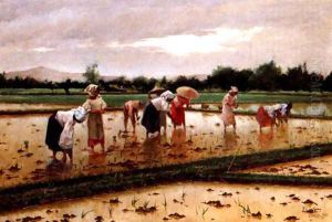 Women working in a rice field by Fabian De La Rosa