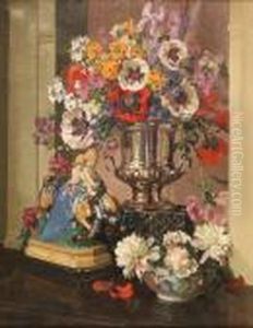 Still Life Study Offlowers In A Silver Campana Vase Beside A Figurine And Bowl