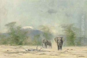 Elephants with Mount Kilimanjaro beyond