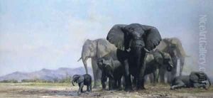 A herd of elephants at a watering hole