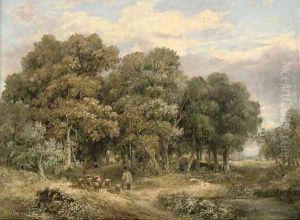 A drover and his flock in a wooded landscape