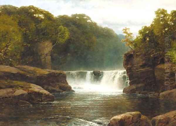A waterfall in a wooded river valley - view 1