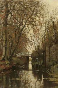 An autumn forest with a washerwoman near a bridge by Petrus Paulus Schiedges