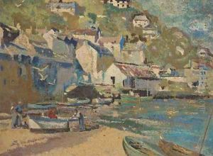 Fishermen by their boat on the shore at a Cornish village
