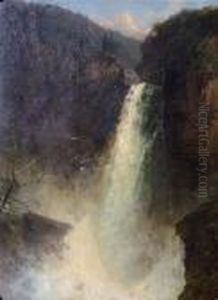 Waterfall In A Wooded River Valley With A Snow Topped Mountain In The Background