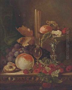 Strawberries, grapes and peaches on a table and pedestal bowl with a glass vase
