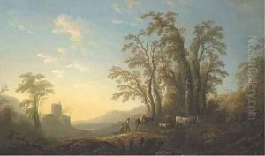 An extensive wooded landscape with cowherds and cattle on a path by the ruins of a castle
