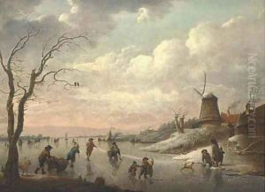 A winter landscape with peasants skating on a frozen river by a village with a windmill