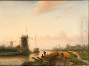 Windmills In A Polder Landscape With Figures On A Track Along Acanal