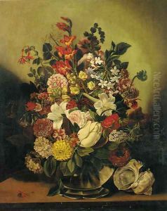 Summer flowers in a glass vase on a table