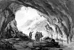 A group of figures visiting a cave by French School