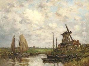 Barges moored before a windmill in a Dutch landscape by Dutch School
