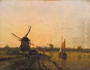 Windmills in a riverlandscape at dusk