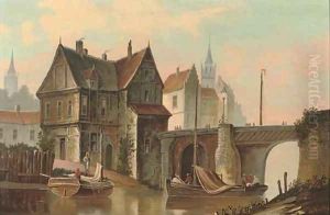 A Dutch canal side town with figures boating by Dutch School