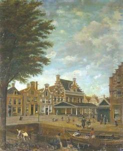 A canal in a Dutch town with merchants loading a vessel and other figures strolling in the streets by Dutch School