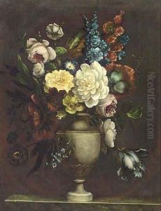 Assorted flowers in an urn on a stone ledge