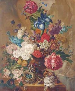 Summer flowers, including irises, tulips, roses in vase, with a bird's nest and eggs to the side