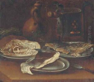 A warming plate, a jug, asparagus and three pewter plates with pieces of fish on a table