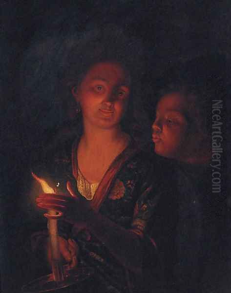 A boy blowing a candle held by a lady - view 1