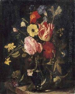 Roses, tulips, an iris, pansies and an anemone in a glass vase on a stone ledge by Daniel Seghers