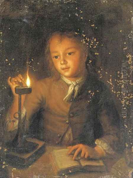 A boy reading by candlelight - view 1