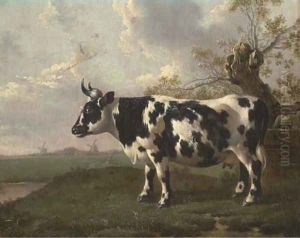 A pastoral landscape with a cow by a pollard willow
