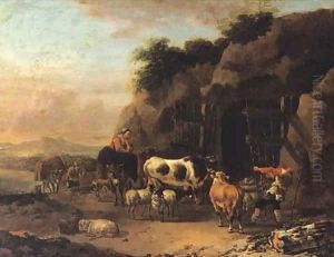 Peasants driving their cattle and sheep into a cave in an Italianate landscape