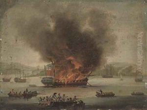A frigate ablaze offshore