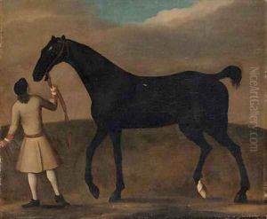 A racehorse held by a groom