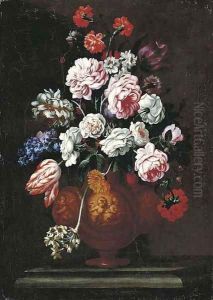 Roses, carnations, tulips and other flowers in a sculpted urn on a stone ledge by Giovanni Stanchi
