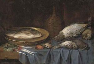 Dead birds, a fish on a copper platter, a bottle of wine and root vegetables on a draped table by Sebastien Stoskopff