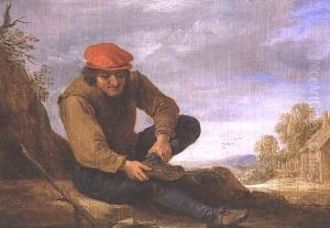 Seated man removing his shoe