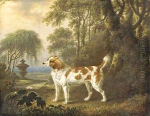 A Marlborough spaniel in a wooded landscape, an urn beyond by Charles Towne