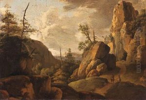 A Rocky Landscape With Horsemen On A Track