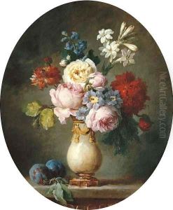 A vase of flowers and two plums on a marble tabletop
