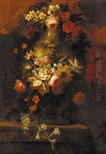 Roses, carnations, daffodils, a sunflower and other flowers in a stone urn, with grapes on the vine on a stone ledge - view 1