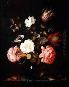 Flowers in a glass vase on a draped table