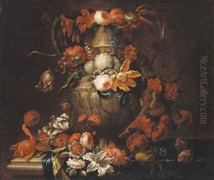 Roses, tulips, narcissi, carnations, blue bells, and other flowers decorating an urn on a ledge by Gaspar-pieter The Younger Verbruggen