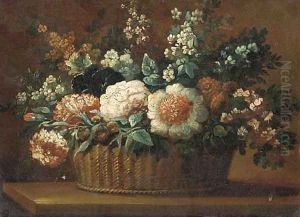 Carnations, roses and other flowers in a basket on a ledge 2