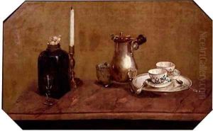 A silver coffee pot,