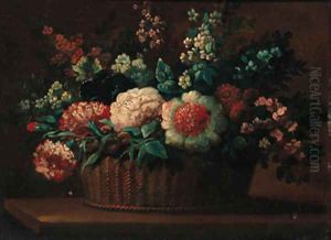 Carnations, roses and other flowers in a basket on a ledge