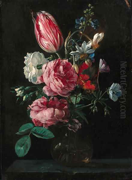 Roses, narcissi, a parrot tulip and other flowers in a glass vase on a ledge - view 1