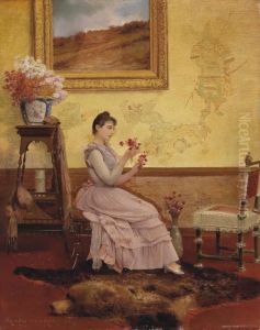 A Woman Arranging Flowers In An Interior by Georges Croegaert