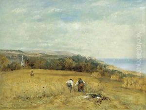 Harvesters in a cornfield on the Isle of Wight, Flambro castle beyond